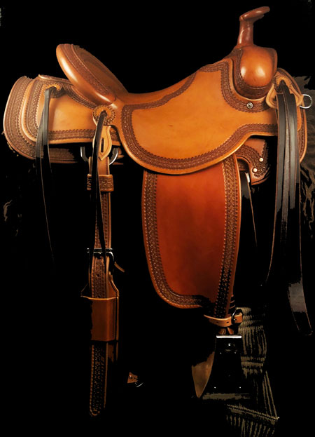 Will James tree, 16 inch seat, Gullet - 7 and 1/2 inch by 6 and 1/4 inch by 4 inch, Horn 2&1/2 inch Metal Dally, 92 degree bars, 7/8ths flat palte riggin, Cheyenne Roll, Full Vaquero Lace Border Saddle built by Keith Valley.